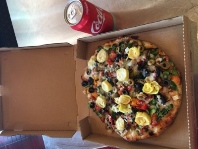 Any Specialty 10" Pizza with a Drink Image