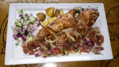 Specialty Fried Whole Snapper With Sauteed Onions And Potatoes Image
