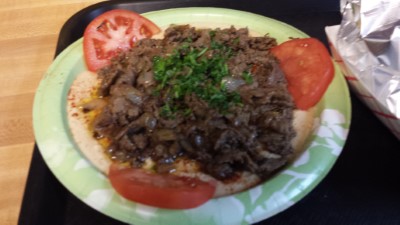 Humus topped with lamb Image