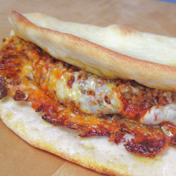 Grinder Spicy Sausage Flatbread Sandwich Image