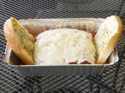 Beefy Lasagna with side of Garlic Bread Image