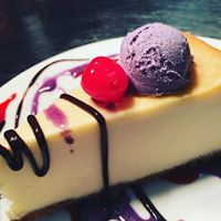 D9. Cheesecake Slice With Ube Ice Cream On The Side Image