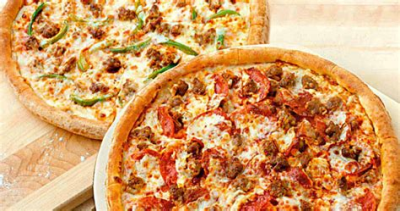 2 12" medium pizzas 2 toppings $16.99 Image
